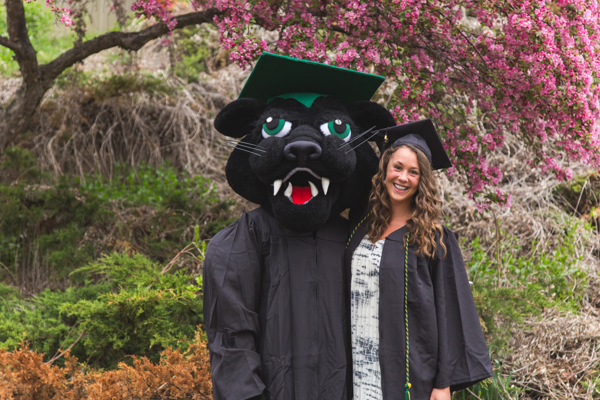 Pemi the Panther, resplendent in academic regalia, posed with graduates to celebrate their special day. Kaleb Hart ’11 photo.