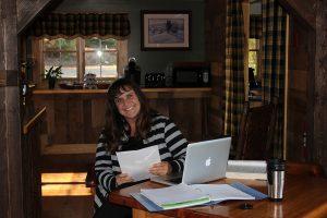 Dr. Maria Sanders working at a table in New Hampshire