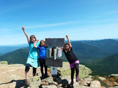 Three children at the summit of Mt. Lafayette in 2013