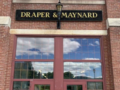 Faculty Exhibition - Draper & Maynard sign on building