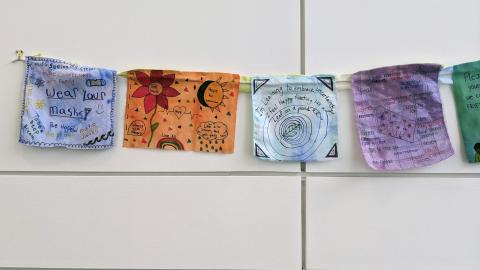Plymouth State in 150 Objects exhibition painted handwritten notes about COVID