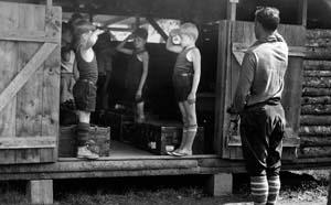 Boys saluting at Camp Pemigewassett.