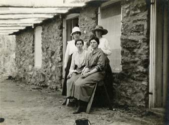Four women outside AMC Hut. Photograph by Ralph C. Larrabee.