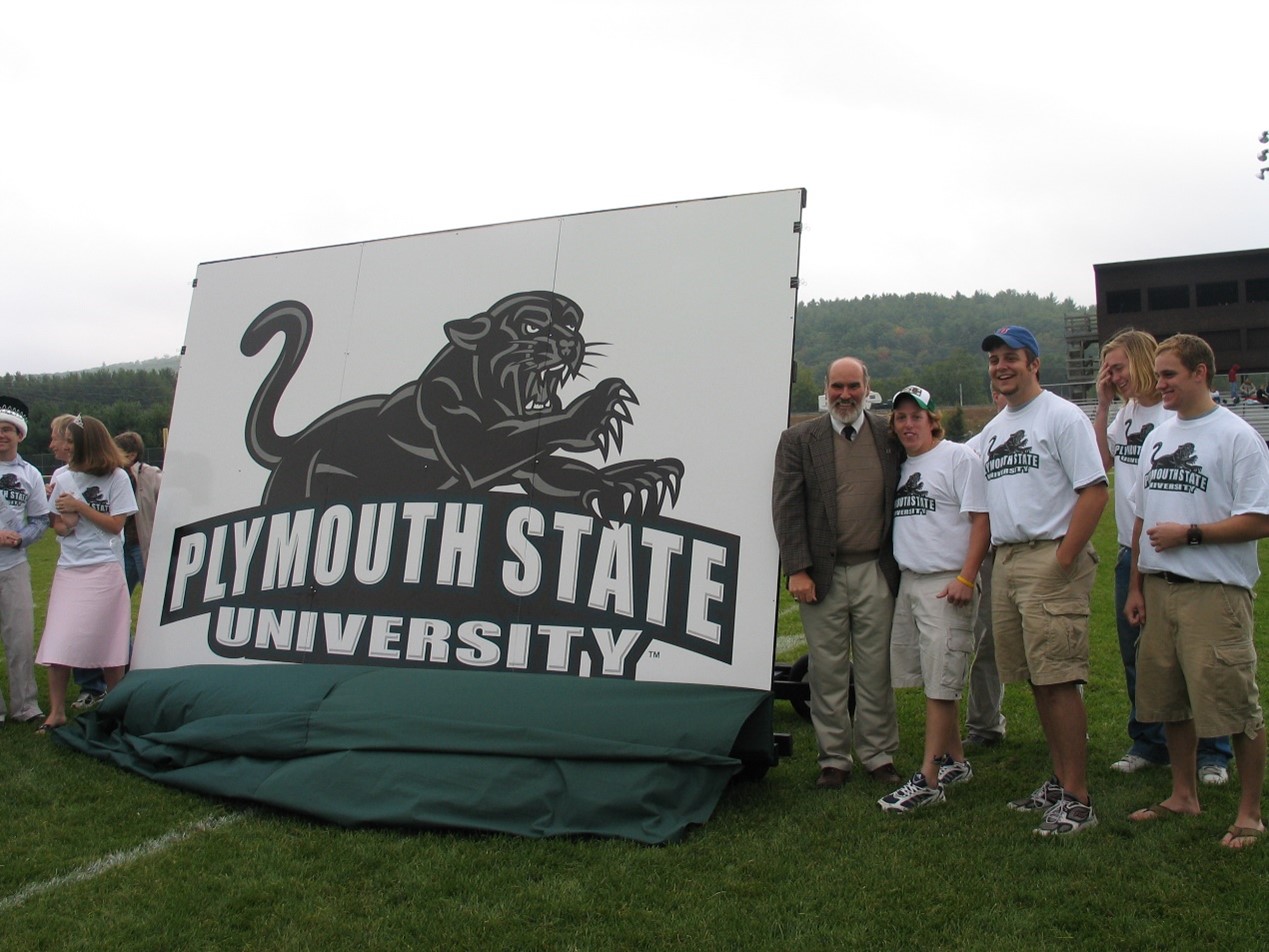 Former President Donald P. Wharton and students celebrating the new Plymouth State University logo in 2004