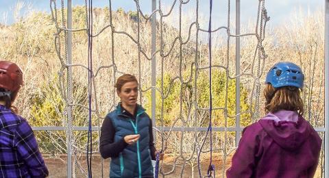 students receiving instruction during climbing class