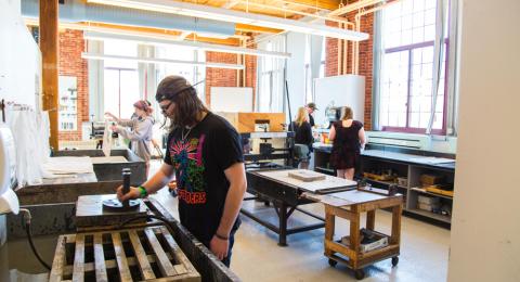 Students using the printmaking studio