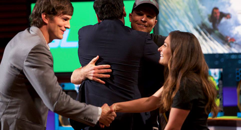 Angela Watts shaking hands with Ashton Kutcher