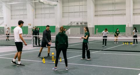 Students playing a round of spike ball in ALLWell North. 