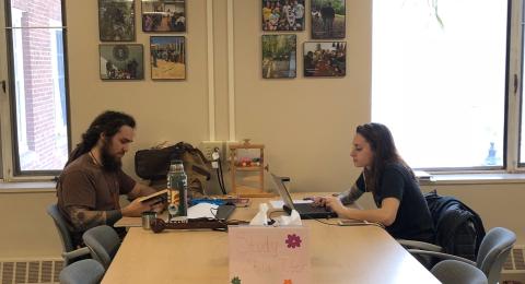 Two students working at a table