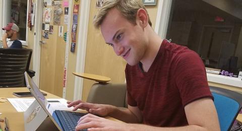 Student studying on laptop