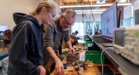 Professor and student working on a project