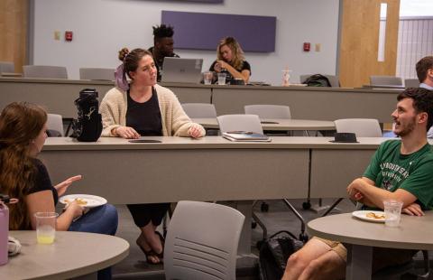 Students sitting and talking in the classroom