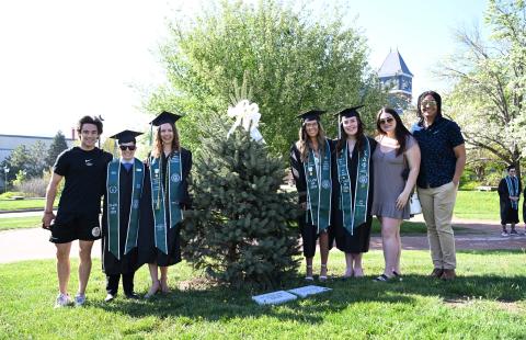 Future Alumni Board posing by their newly planted tree