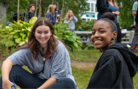 Students sitting on the grass during PSU orientation