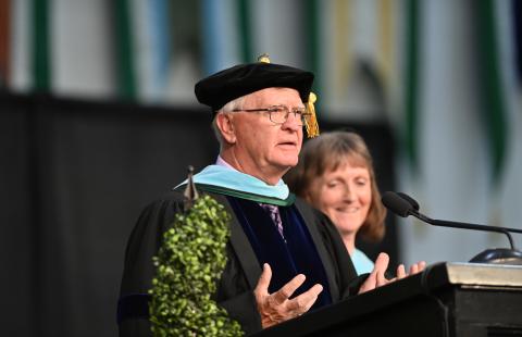 Faculty giving speech at commencement