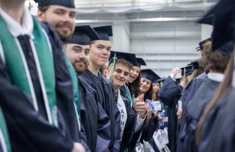 Undergraduates lined up posing for a photo.