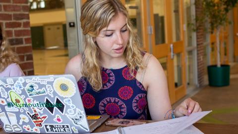 Plymouth student studying in campus building