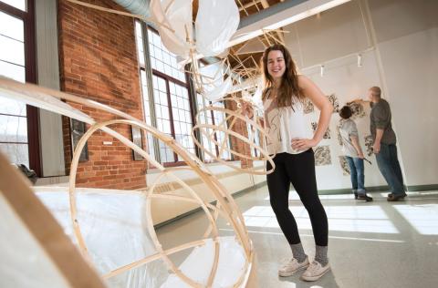 Student at art exhibit