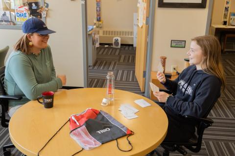 Students talking at a table