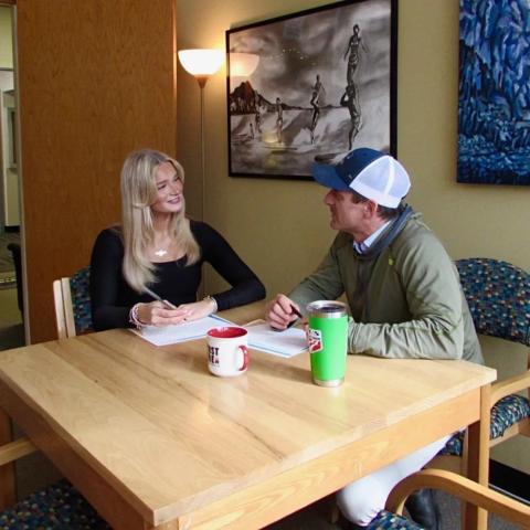 Two individuals talking to each other.