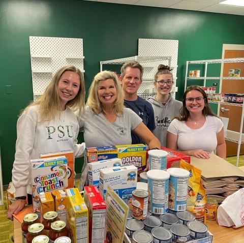 Student Support Foundation with Carrie and John ‘85 Morgridge in the student-run food pantry.