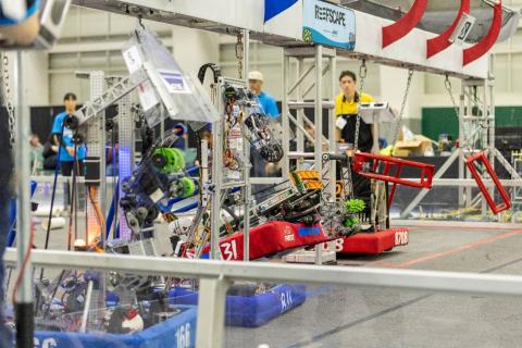 Governor’s Cup competitors harvest algae and climb onto a central “barge” structure 