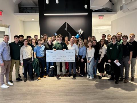 PSU Sales Institute Group Photo Holding One Check