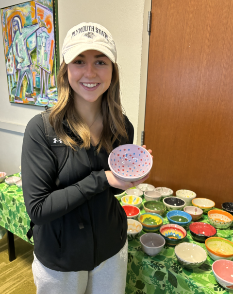 Woman holding a bowl.