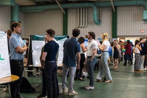 Students in a group setting presenting their student showcase projects.