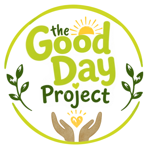 The Good Day Project Logo with two hands holding a heart, surrounded by leaves.