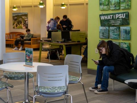 Students sitting in a lobby
