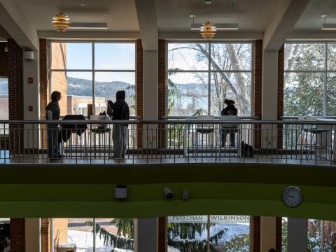 Students standing near a window
