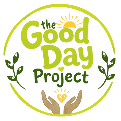 The Good Day Project Logo with two hands holding a heart, surrounded by leaves.