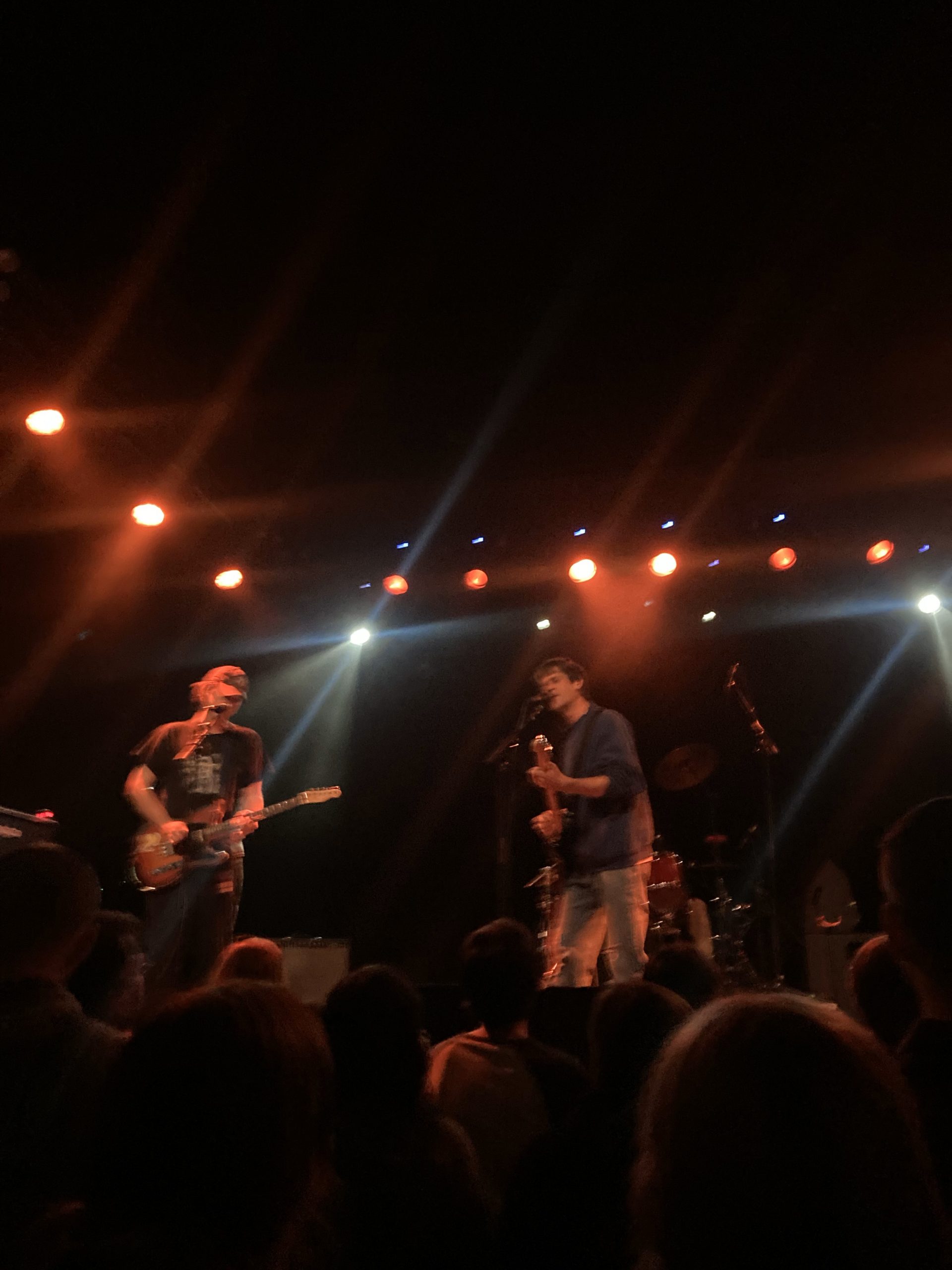 A picture of two men on a stage at a concert.