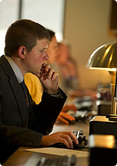 A student studies at one of the library computer stations.